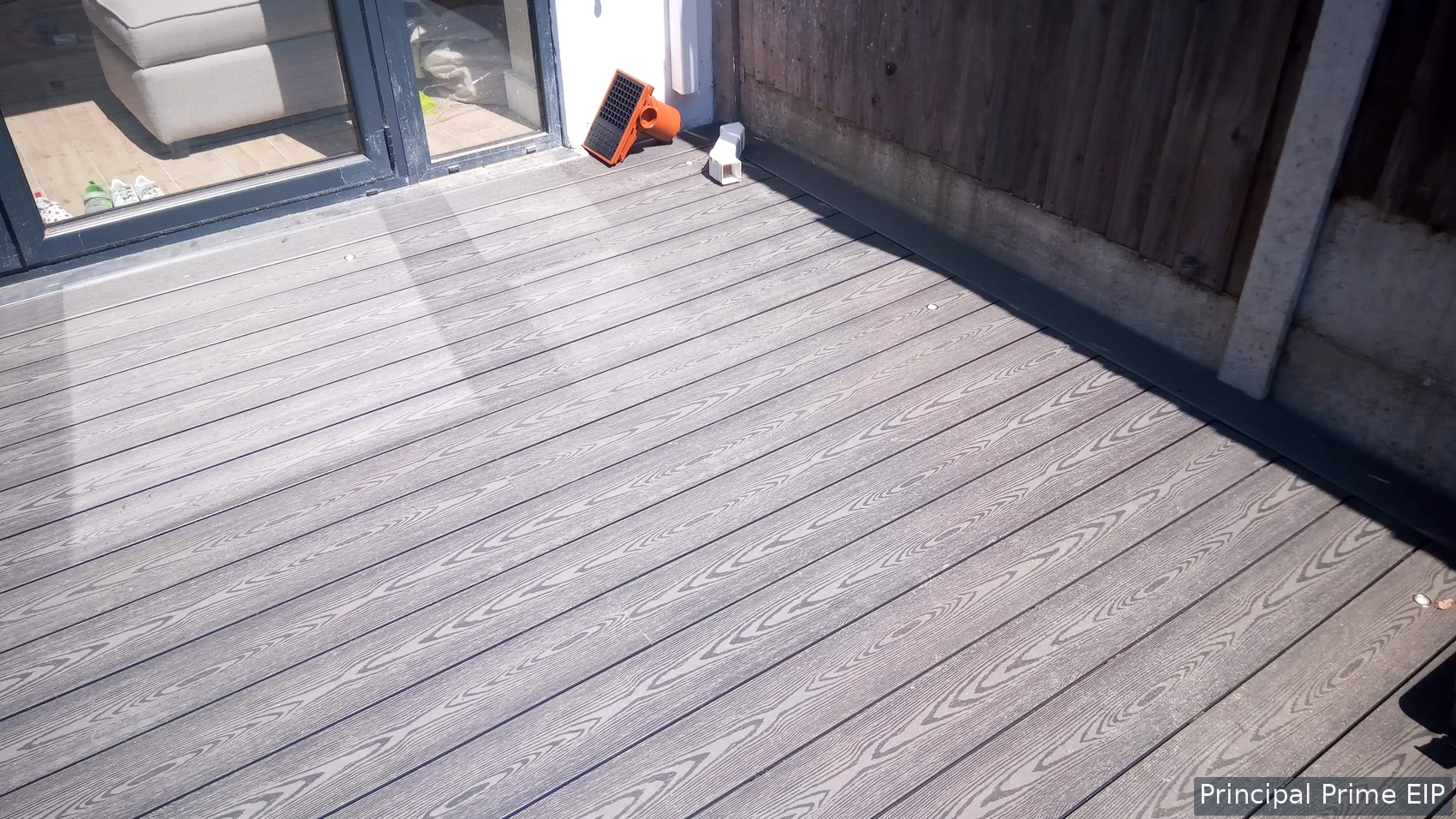 Completed garden decking beside the house Completed garden decking beside the house
