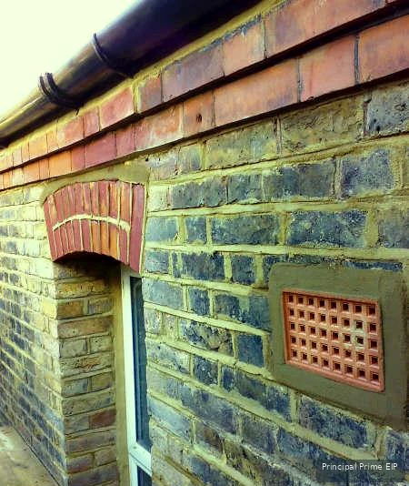 Repointed brick wall with ventilation detail Repointed brick wall with ventilation detail