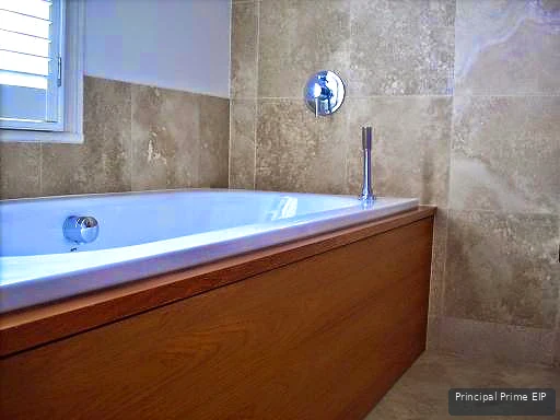 Stone wall tiles and timber bath surround Stone wall tiles and timber bath surround