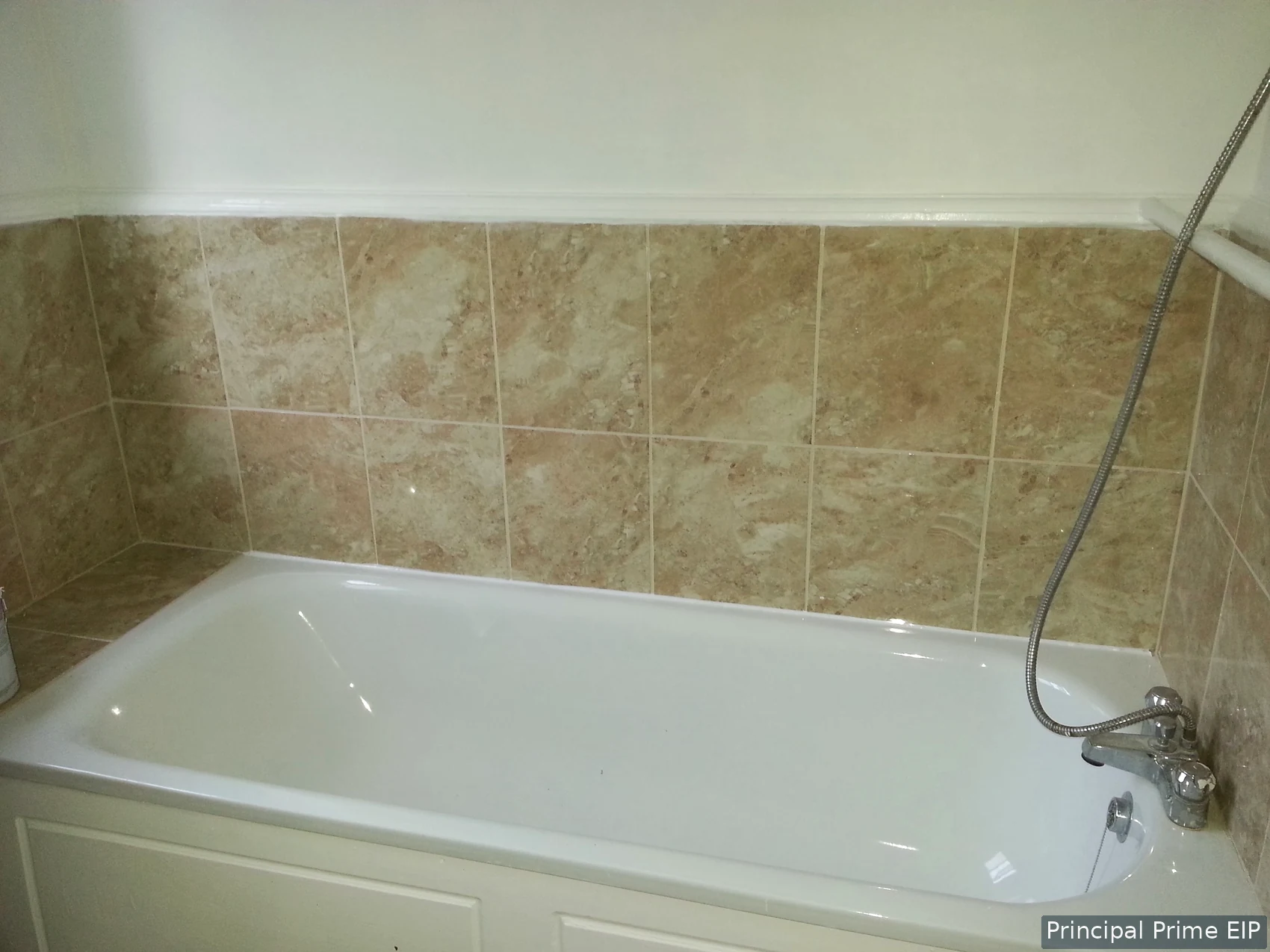 Fitted bath with coordinated stone-effect wall tiles Fitted bath with coordinated stone-effect wall tiles.