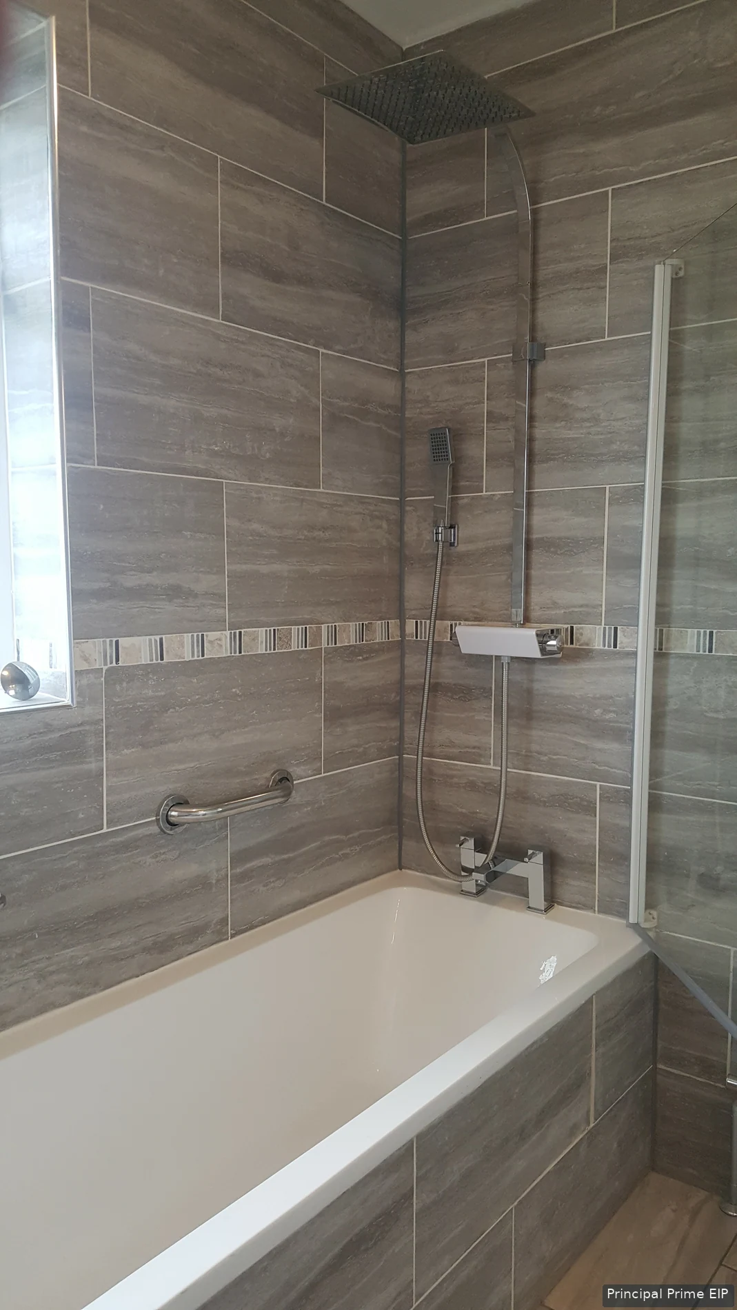 Bath and shower screen with coordinated wall tiling Bath and shower screen with coordinated wall tiling in Merton (SM4).