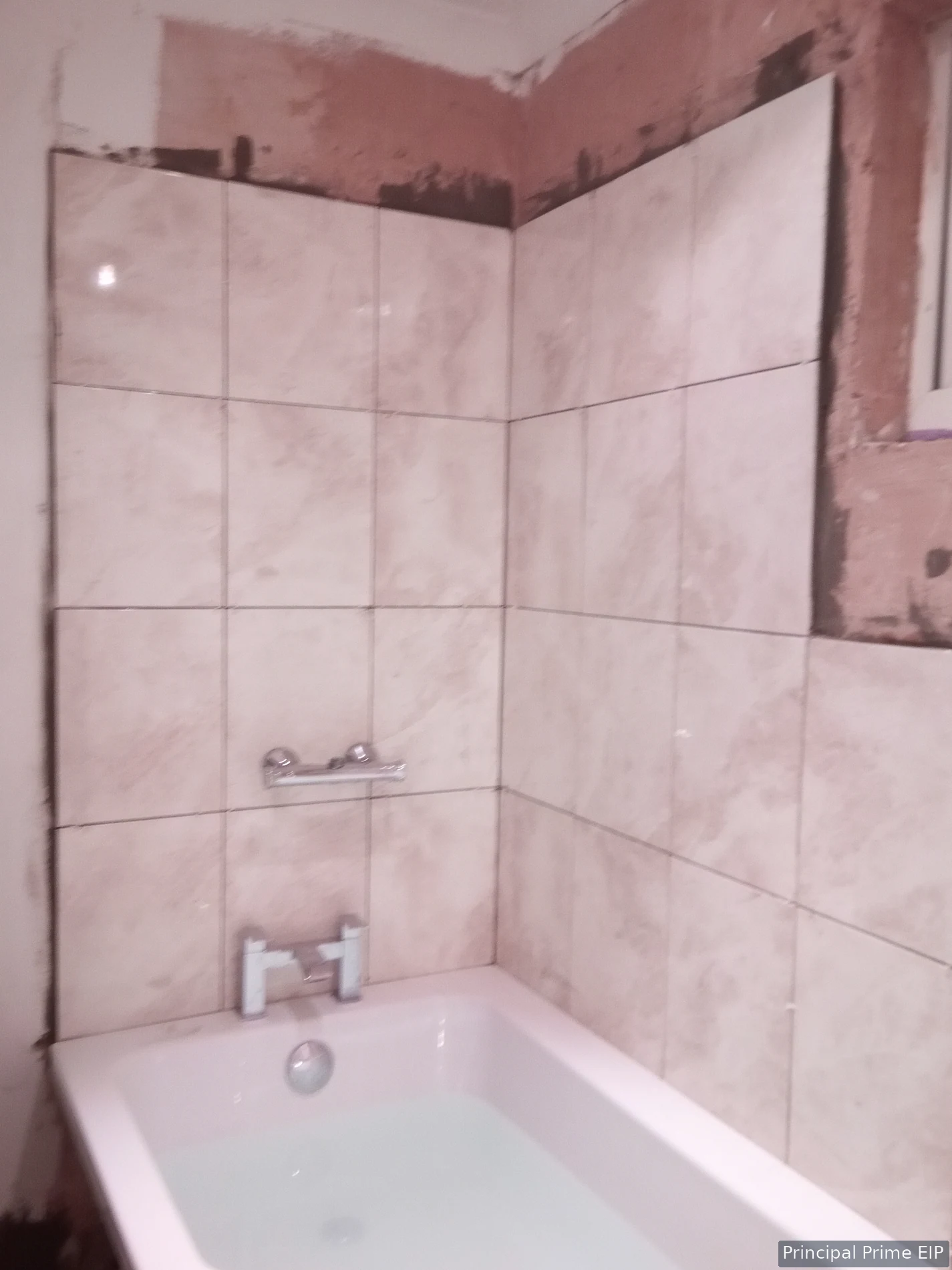 Bath and wall tiling during bathroom renovation Bath and wall tiling during bathroom renovation.