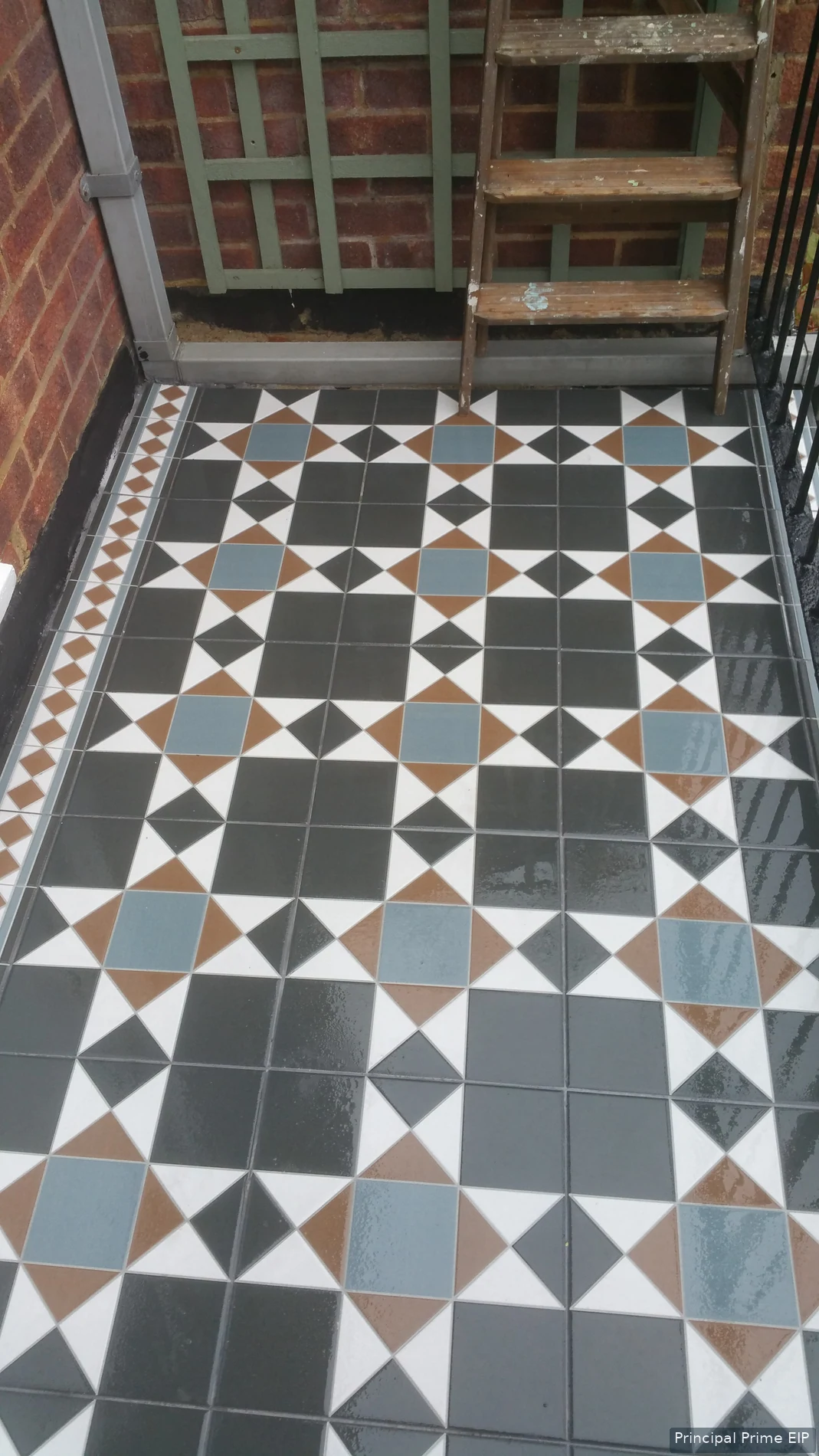 Patterned entrance tiles with contrasting border details Patterned entrance tiles with contrasting border details.