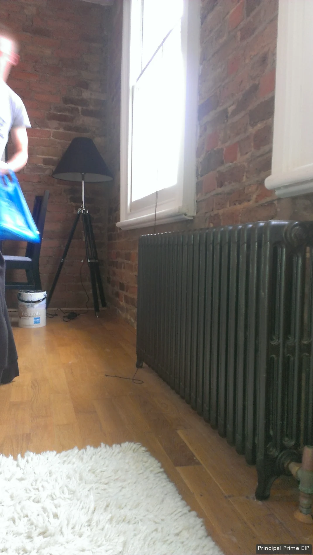 Column radiator against exposed brickwork Column radiator against exposed brickwork.